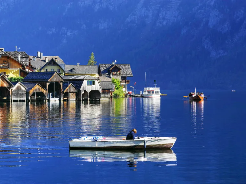 Wooden boathouses on the shore of Lake Hallstatt