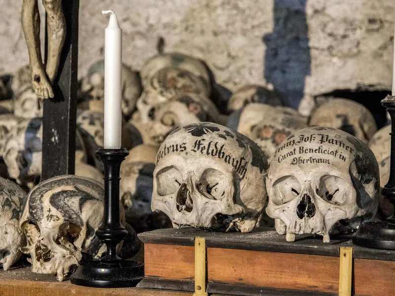 Painted skulls with names and floral wreaths in the Hallstatt Charnel House