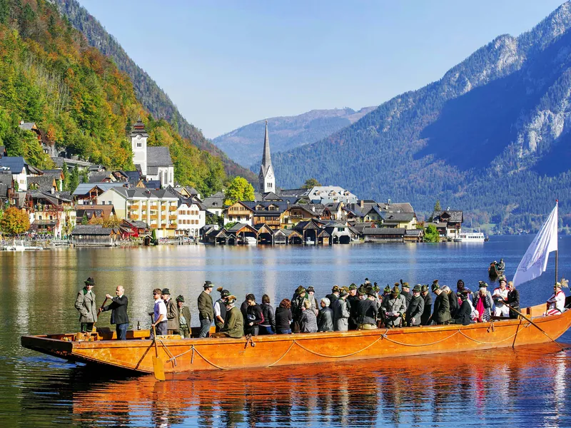 Traditional flat-bottomed Plätte boat carrying passengers on Lake Hallstatt