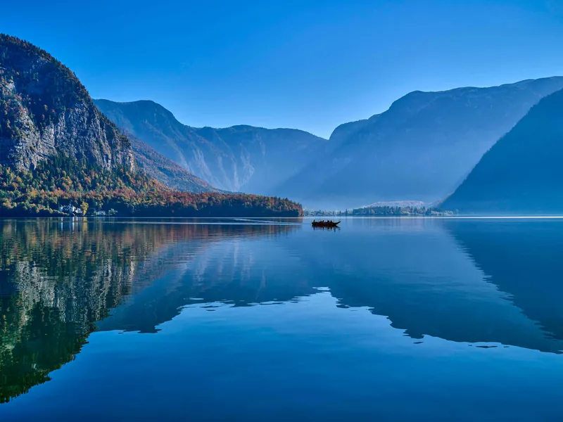 Still water of Lake Hallstatt with mountains reflected