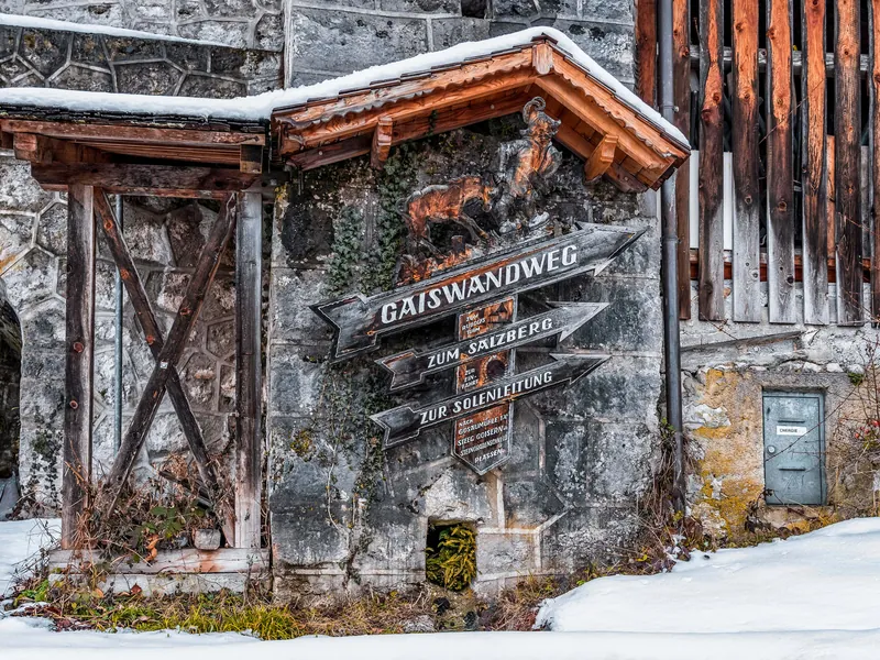 Wooden signpost on the Salzberg trail above Hallstatt in winter